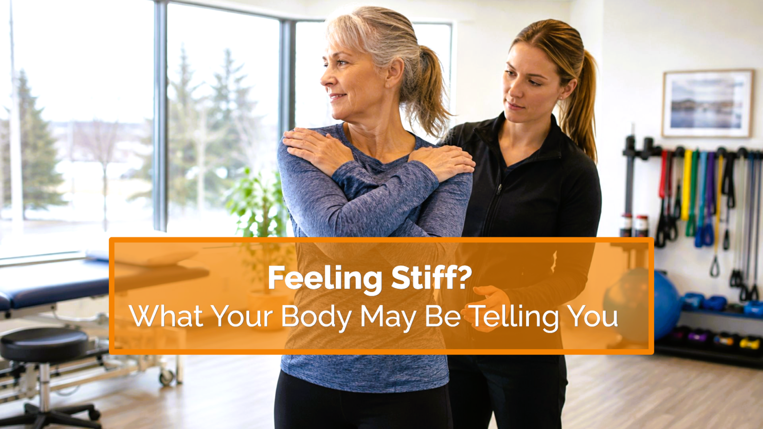 Physiotherapist guiding a woman through mobility exercises to help reduce stiffness and improve movement.
